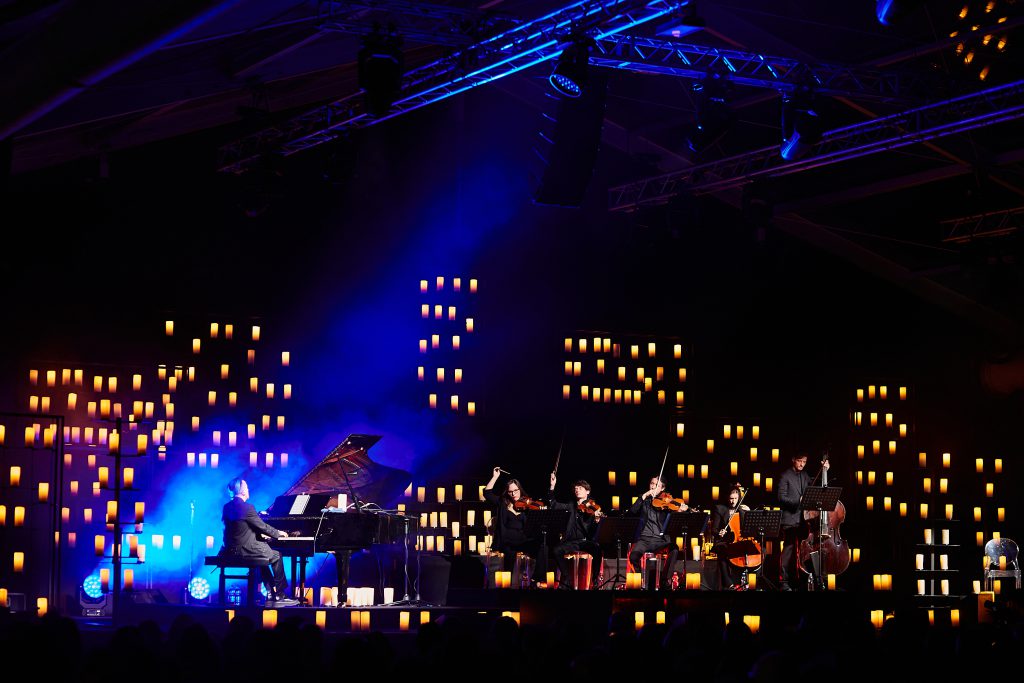 opening inauguration of Palazzo Sidera, new headquarters of Cia-Conad in Forli Italy. Boogies, individually controlled candle lights, show Dardust, Elisa Toffoli