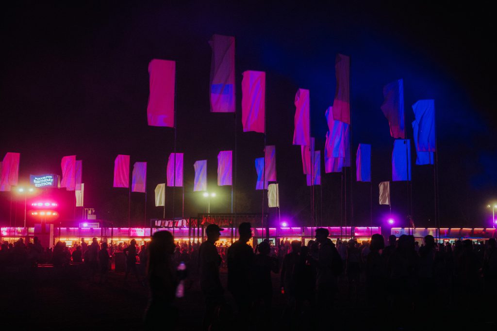 Pukkelpop Festival Kiewit Belgium 2025 site boulevard flags by night lights